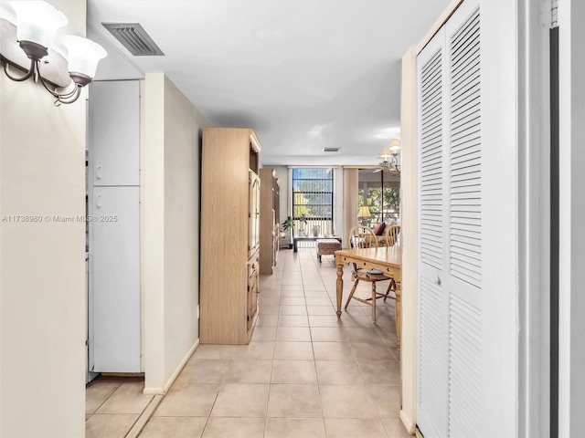 hallway featuring light tile patterned flooring