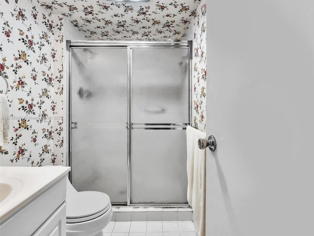 bathroom with vanity, an enclosed shower, tile patterned floors, and toilet