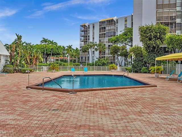 view of swimming pool with a patio