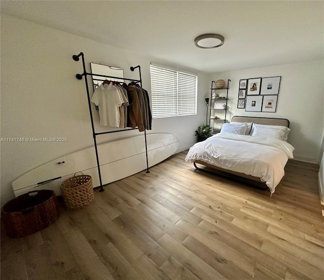 bedroom with light hardwood / wood-style floors