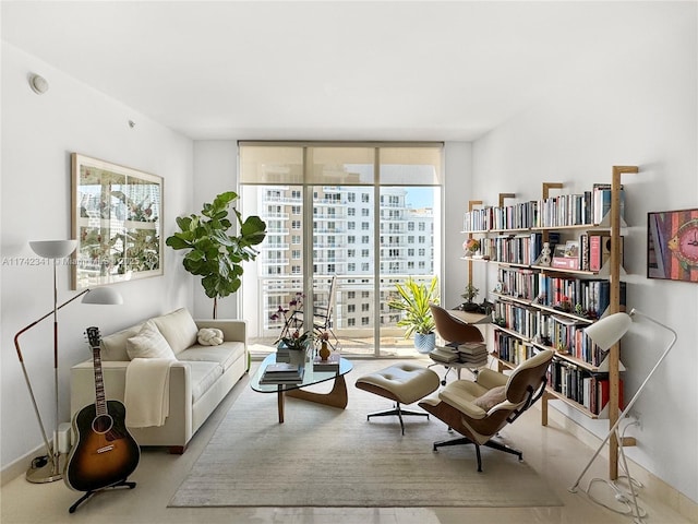 living area featuring floor to ceiling windows