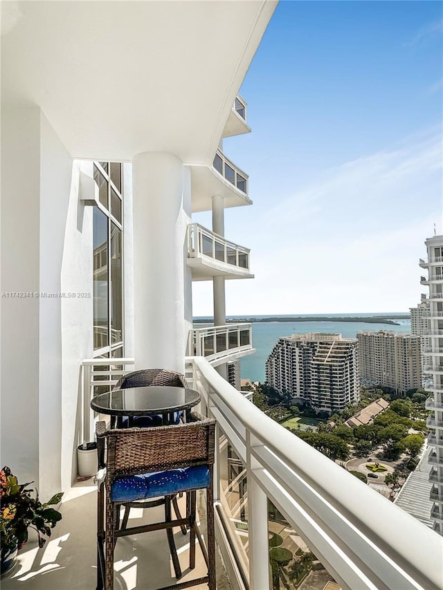 balcony featuring a water view