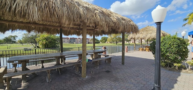 view of community featuring a gazebo and a water view