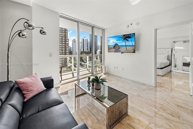 living room featuring floor to ceiling windows