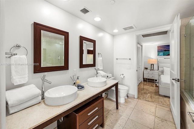 bathroom with vanity, an enclosed shower, and toilet