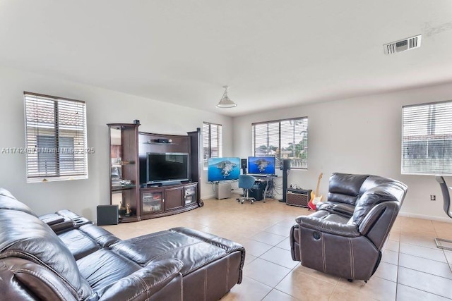 tiled living room with plenty of natural light