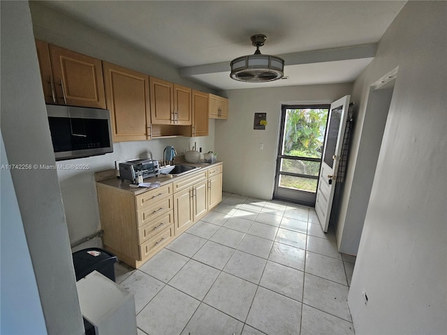 kitchen with sink and light tile patterned floors