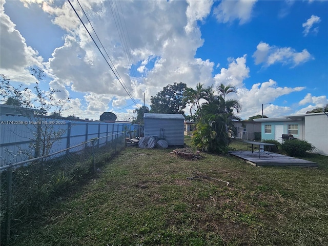 view of yard featuring a storage shed and a patio