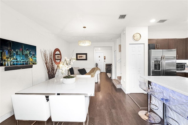 dining room featuring dark hardwood / wood-style flooring