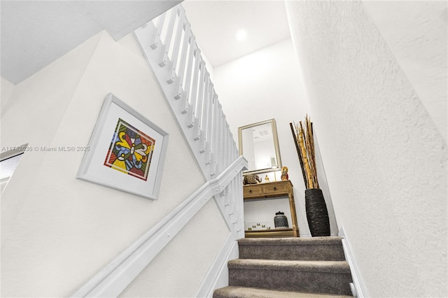 stairway with a towering ceiling