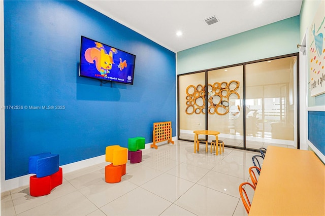 game room with tile patterned flooring