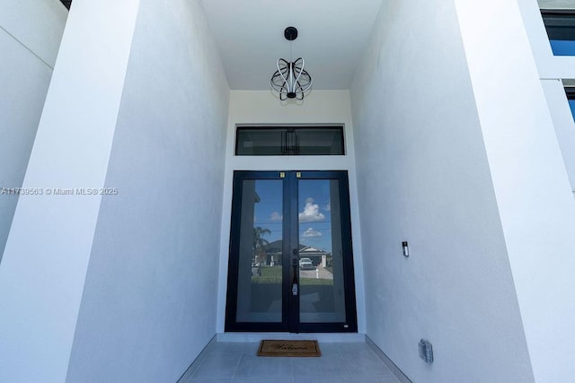 entrance to property featuring french doors