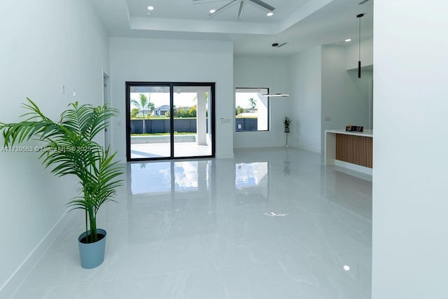 spare room with a raised ceiling and a high ceiling