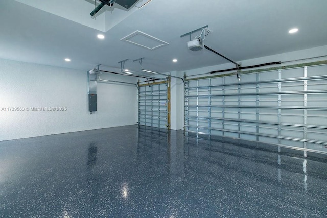 garage featuring a garage door opener and electric panel