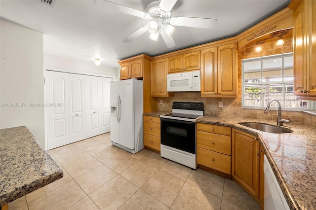 kitchen featuring sink, tasteful backsplash, white appliances, light tile patterned floors, and ceiling fan