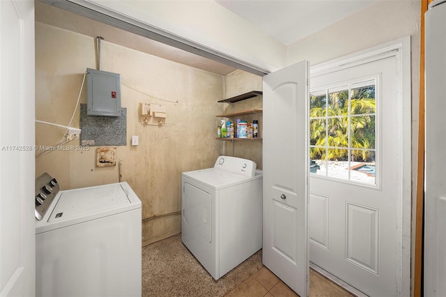 laundry room with plenty of natural light, washing machine and dryer, and electric panel