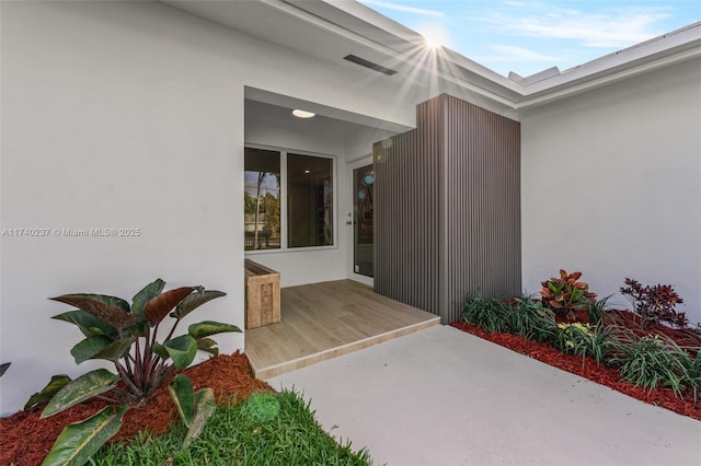 entrance to property with a patio area