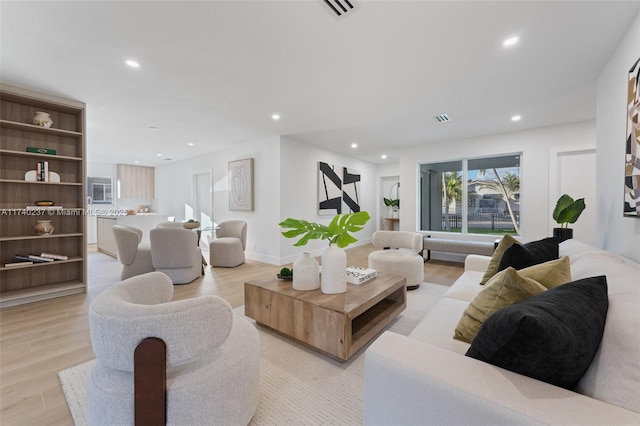 living room with light hardwood / wood-style floors