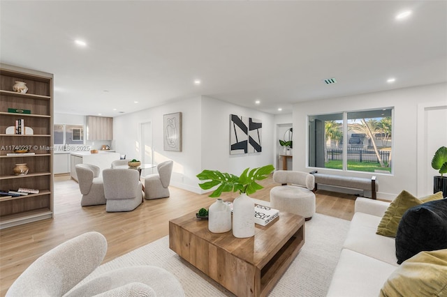 living room with light hardwood / wood-style floors