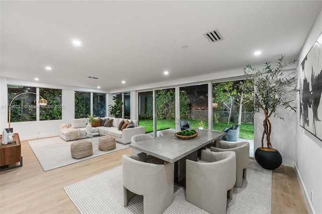 dining room with light hardwood / wood-style flooring