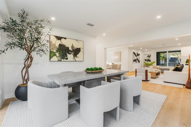 dining space featuring light hardwood / wood-style floors