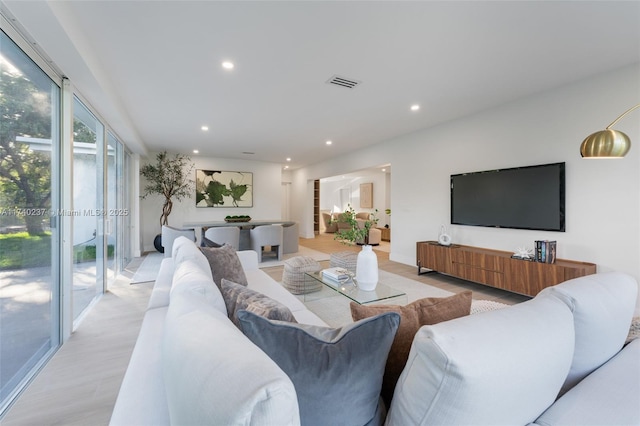 living room with light hardwood / wood-style flooring