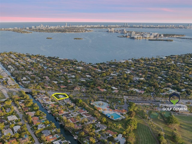 aerial view at dusk with a water view