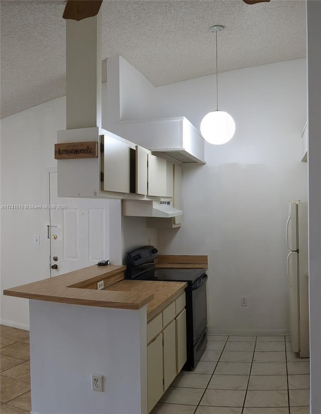 kitchen featuring white cabinetry, hanging light fixtures, a textured ceiling, black / electric stove, and white fridge