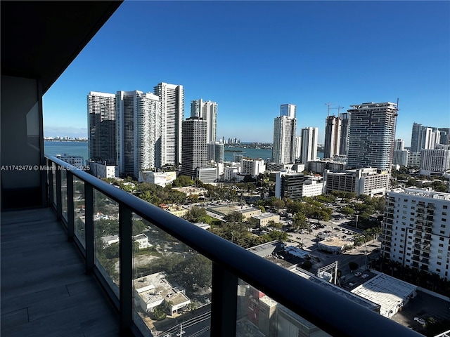 balcony featuring a water view