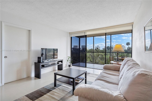 living room with floor to ceiling windows and a textured ceiling