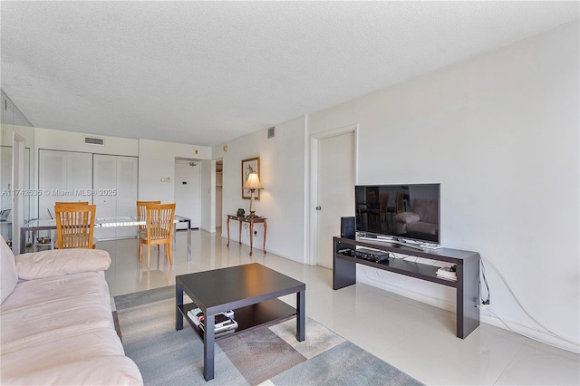 living room featuring a textured ceiling