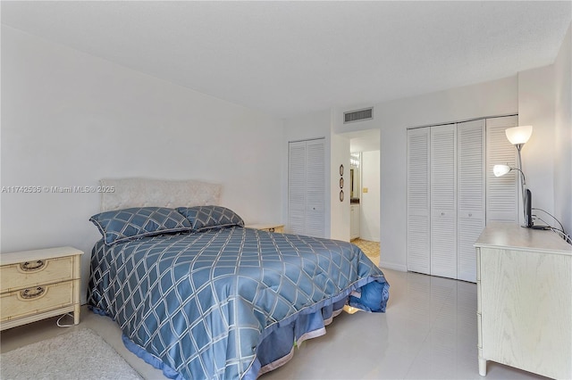 bedroom featuring two closets