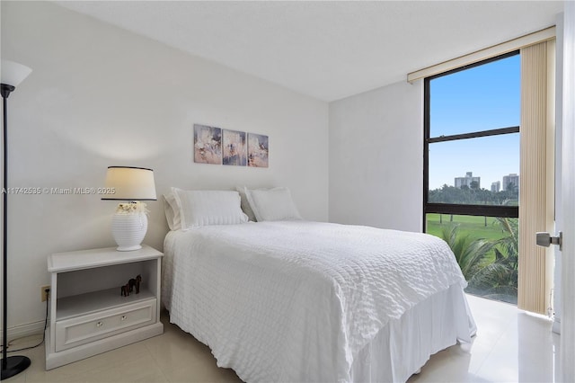 bedroom featuring a wall of windows