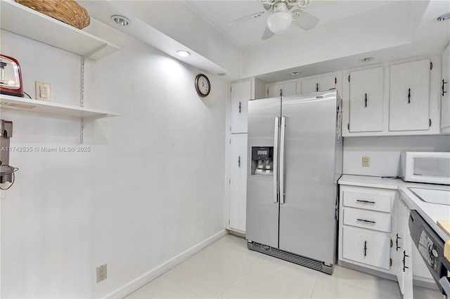 kitchen featuring stainless steel appliances, white cabinetry, light tile patterned floors, and ceiling fan