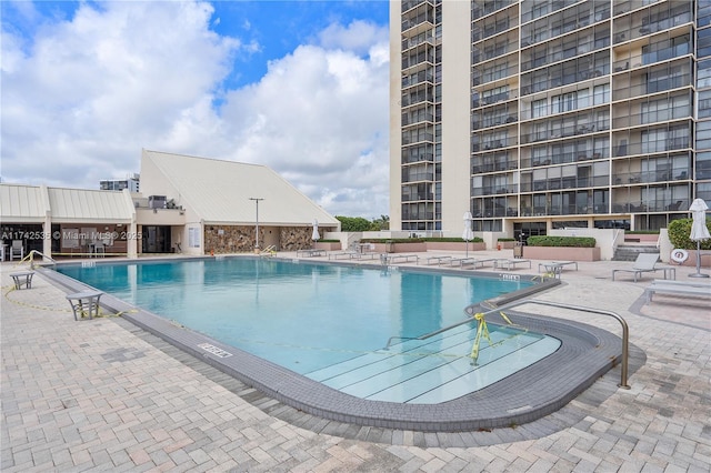 view of pool featuring a patio area