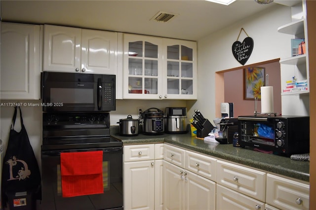 kitchen with white cabinetry and black appliances