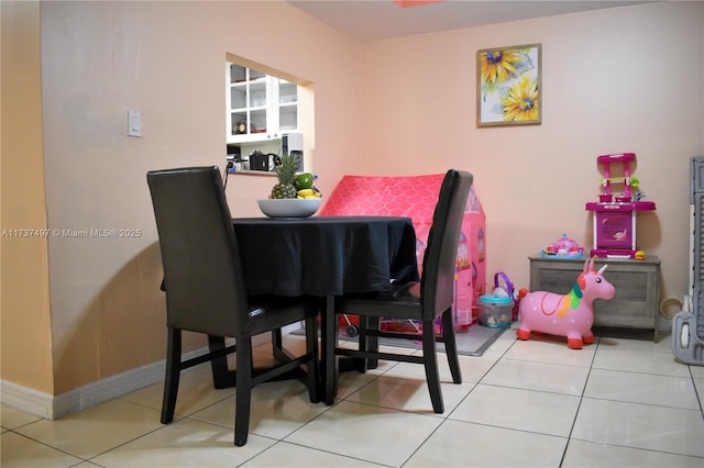 dining area with light tile patterned floors