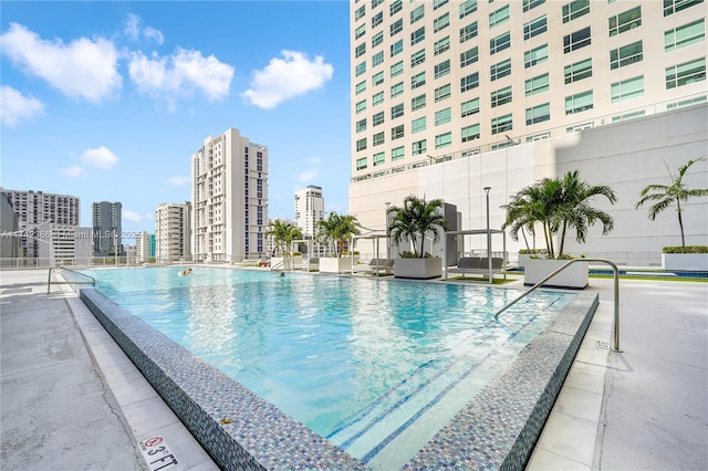 view of swimming pool with a patio