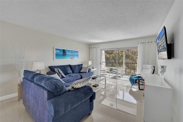 living room with light tile patterned flooring and a textured ceiling