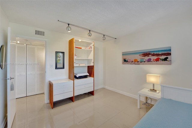 bedroom with a textured ceiling