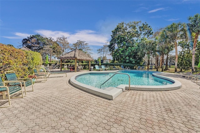 view of swimming pool featuring a gazebo and a patio area