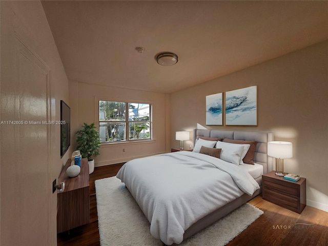 bedroom with dark hardwood / wood-style floors