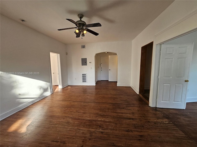 unfurnished room with ceiling fan, dark hardwood / wood-style flooring, and electric panel