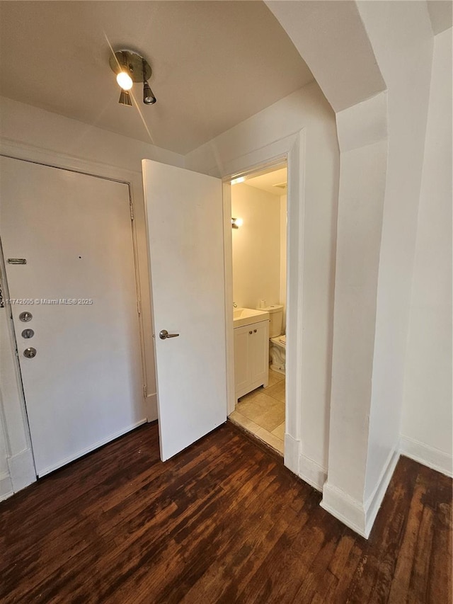 interior space with dark wood-type flooring