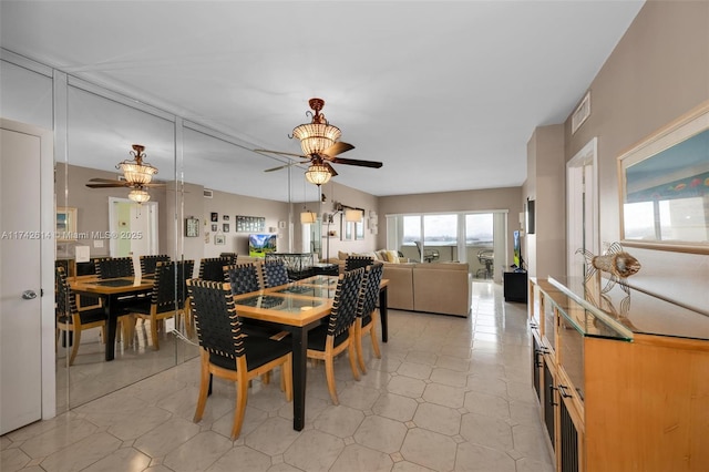 dining room featuring ceiling fan