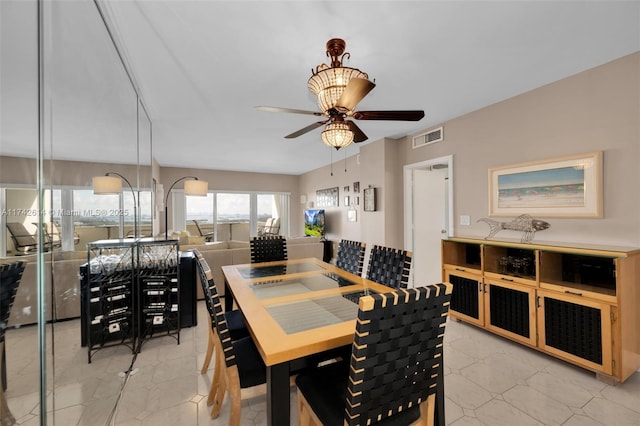 dining room featuring ceiling fan