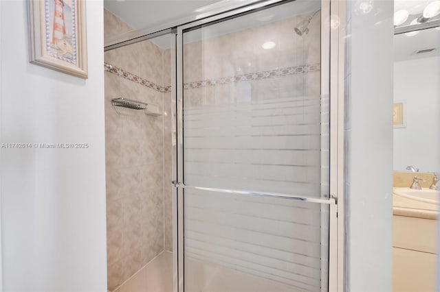 bathroom with vanity and walk in shower