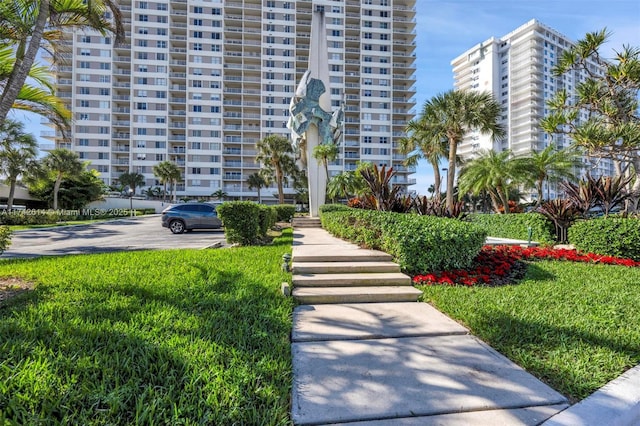 view of community featuring a yard