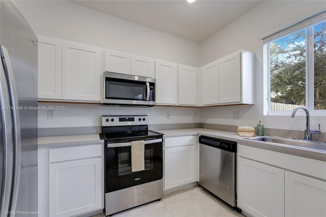 20849 NW 9th Path, Miami Gardens, FL 33169 - kitchen with white cabinetry, appliances with stainless steel finishes, sink, and light tile patterned floors