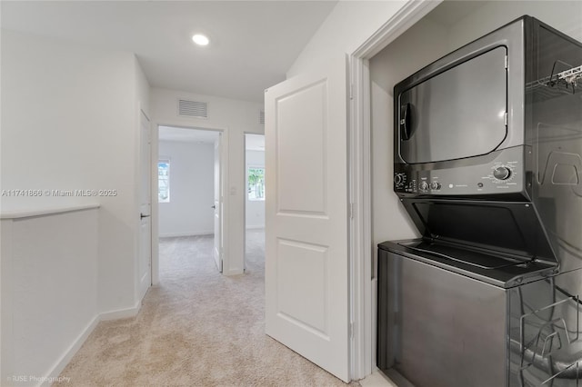 20849 NW 9th Path, Miami Gardens, FL 33169 - laundry room with stacked washer and dryer and light carpet
